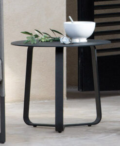 Modern Stainless Steel Black Round Side Table — A modern side table with a bowl, mortar and pestle, & decorative plant