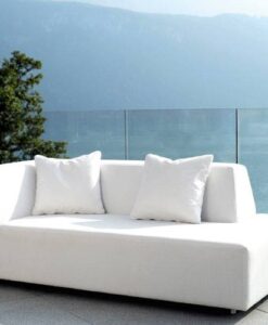 Luxury Amanda 2 Seater Sofa — White sofa with pillows on a terrace overlooking a mountainous lake scene.