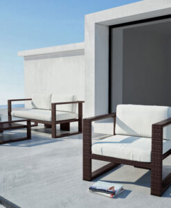 Holly Pacifico Club Chair — Modern outdoor furniture on a patio