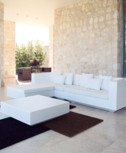 LED Light Modular Sofa — Modern living area with white sectional sofa, stone walls, and open view to outdoors.
