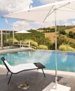 Stackable Chaise Lounge — Infinity pool with lounger, parasol, and countryside view.