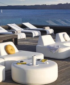 Moon Lounge — Luxury outdoor lounge area with modern white furniture overlooking a tranquil sea and bridge.