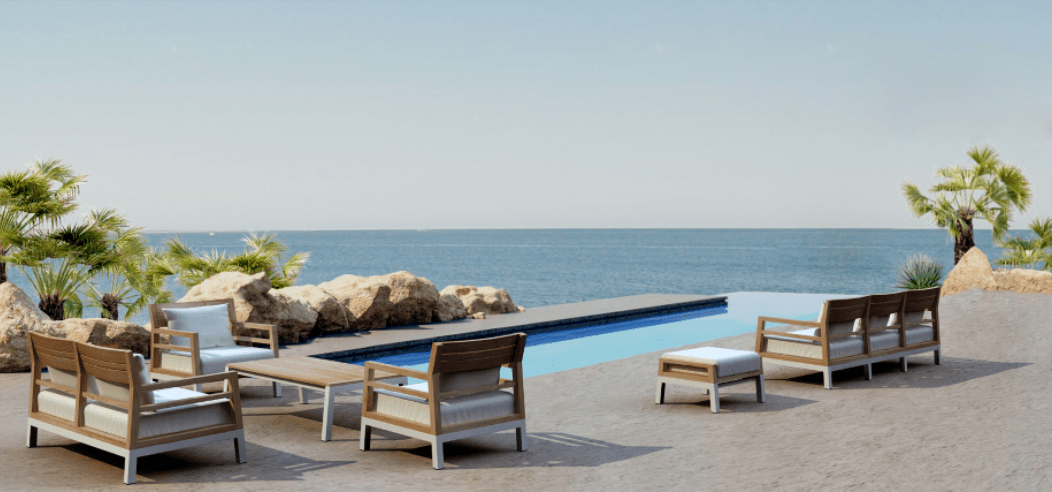 Luxury poolside lounge chairs overlooking a seamless ocean horizon.