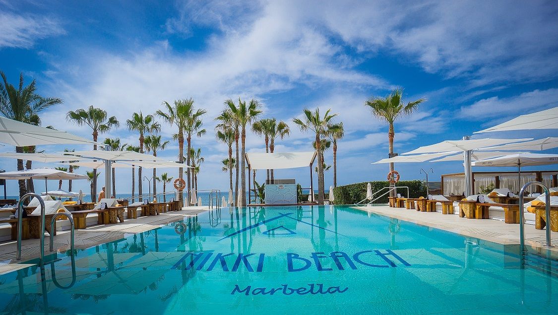 nikki beach pool modern cantilever umbrella marbella ibiza dubai umbrosa st tropez miami
