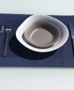 A table setting Melamine Stone Bowls, fork, and knife on a blue table mat