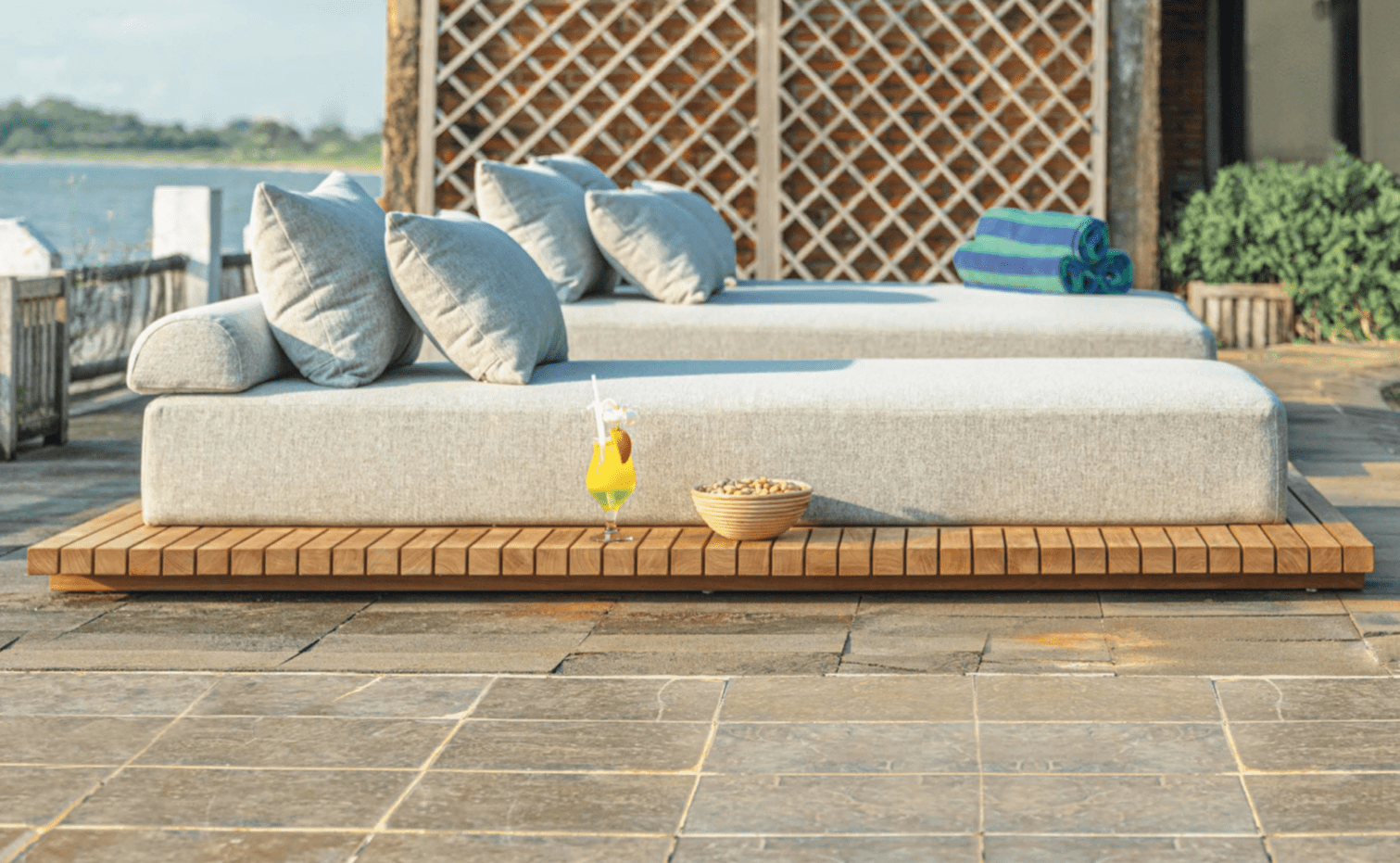 Outdoor Comfy lounge 2 daybed with pillows, a drink & snacks